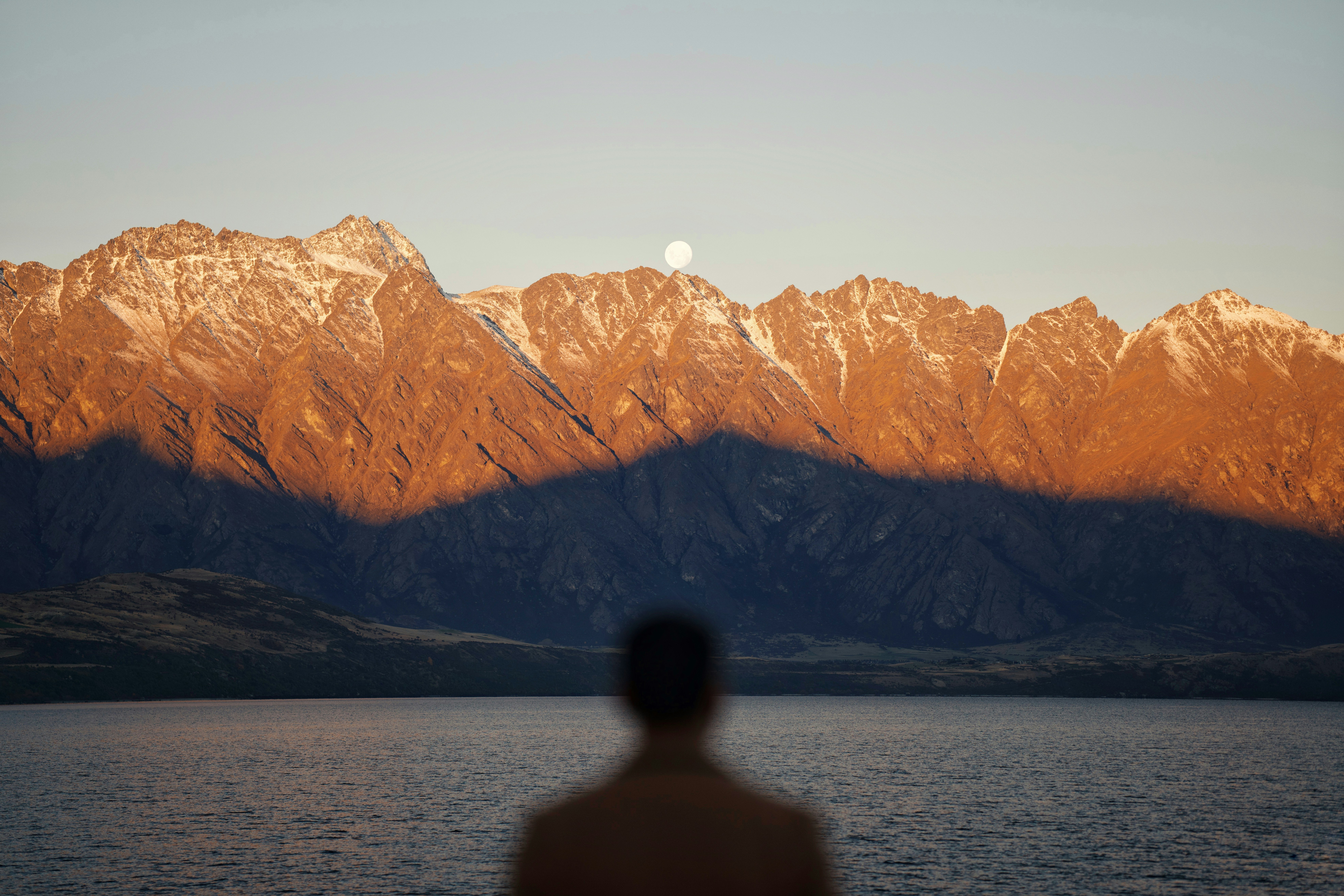 A man looking at a mountain
